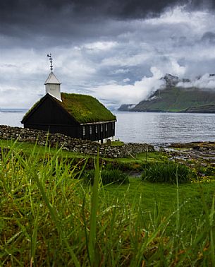 Traditional church of Funningur village, Eysturoy island, Faeroe islands, Denmark, Europe Traditional church of Funningur village, Eysturoy island, Faeroe islands, Denmark, Europe